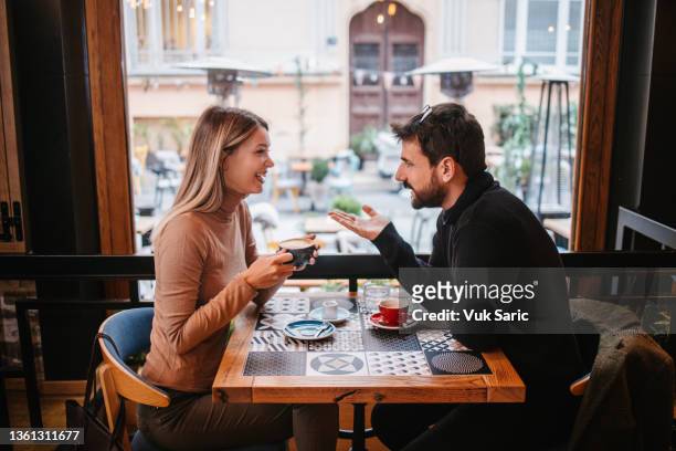 paar auf ein datum - couple in cafe man beard coffee stock-fotos und bilder