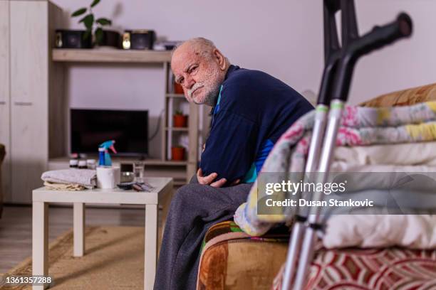 physically disabled senior man, at nursing home - vulnerability stock pictures, royalty-free photos & images