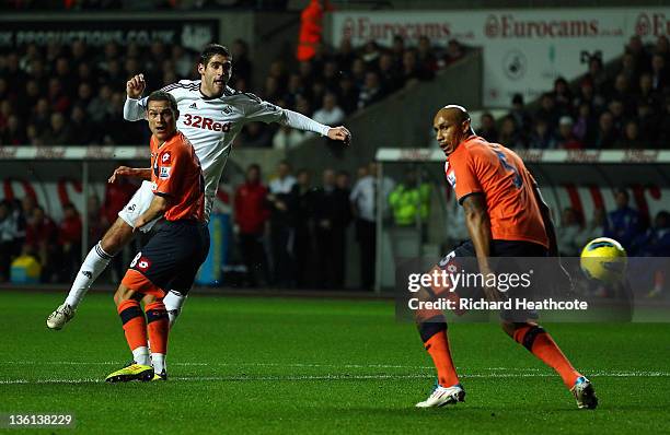 Danny Graham of Swansea scores the opening goal during the Barclays Premier League match between Swansea City and Queens Park Rangers at the Liberty...