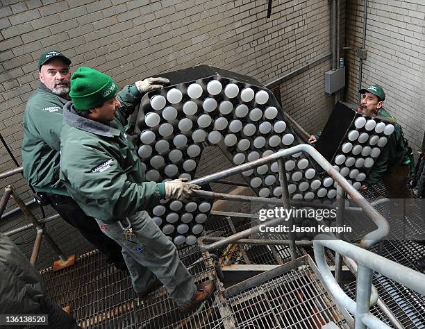 Workers bring the number two light up to the 2012 Times Square New Year's Eve Ball at One Times Square on December 27, 2011 in New York City.