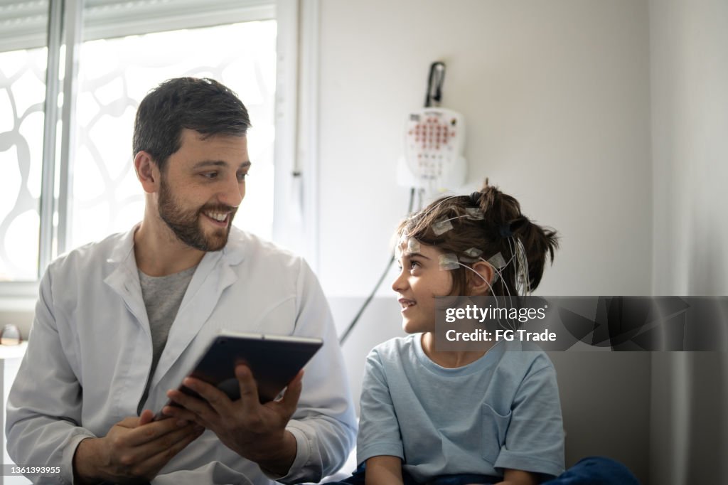 Doctor talking to a boy before polysomnography (sleep study)