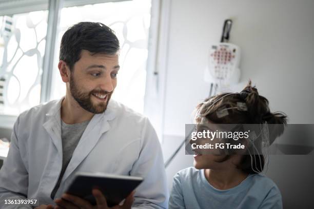 doctor talking to a boy before polysomnography (sleep study) - brain activity stock pictures, royalty-free photos & images