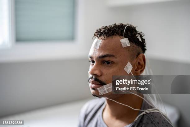 patient with electrodes on his head for polysomnography (sleep study) - electrode stock pictures, royalty-free photos & images