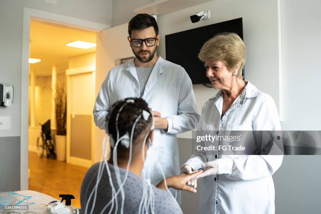 Doctors talking to the patient before polysomnography (sleep study)