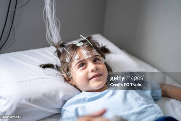boy talking to the doctor before polysomnography (sleep study) - sleep apnea stock pictures, royalty-free photos & images