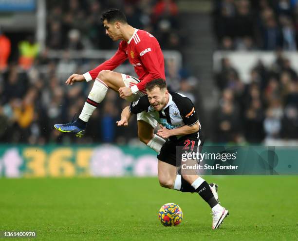 Ryan Fraser of Newcastle United is fouled by Cristiano Ronaldo of Manchester United during the Premier League match between Newcastle United and...