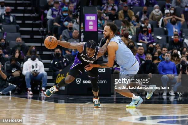 Terence Davis of the Sacramento Kings is defended by Kyle Anderson of the Memphis Grizzlies in the third quarter at Golden 1 Center on December 26,...