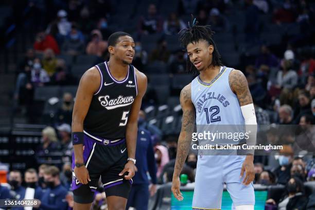 De'Aaron Fox of the Sacramento Kings talks to Ja Morant of the Memphis Grizzlies in the fourth quarter at Golden 1 Center on December 26, 2021 in...