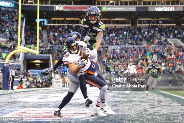 Jimmy Graham of the Chicago Bears catches the ball over Ryan Neal and John Reid of the Seattle Seahawks to bring Chicago within one point during the...