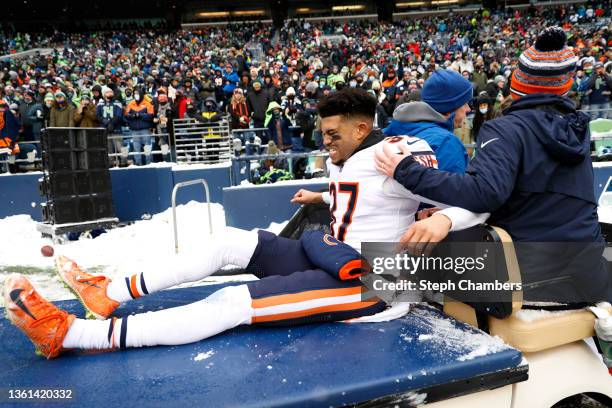 Teez Tabor of the Chicago Bears is carted off the field during the second quarter against the Seattle Seahawks at Lumen Field on December 26, 2021 in...