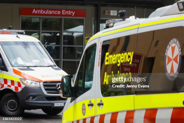 An ambulance arrives at St Vincent's Hospital on December 28, 2021 in Sydney, Australia. COVID-19 testing clinics are at capacity in Sydney with...