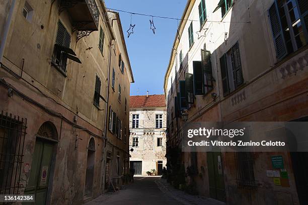 Typical ligurian narrow street on December 27, 2011 in Finale Ligure, Italy. Finale Ligure is a commune in the Province of Savona, divided into three...