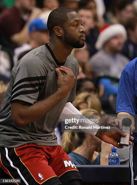 Dwyane Wade of the Miami Heat applies Mission Court Grip at American Airlines Center on December 25, 2011 in Dallas, Texas.