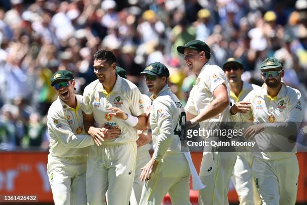 Scott Boland of Australia celebrates with teammates after dismissing Mark Wood of England during day three of the Third Test match in the Ashes...