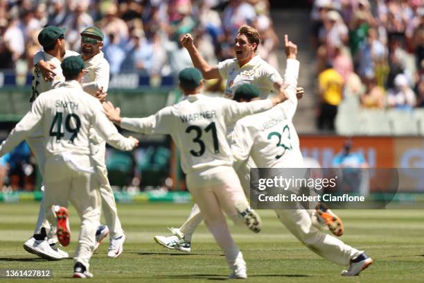 Cameron Green of Australia celebrates with teammates after dismissing James Anderson of England and retaining the Ashes during day three of the Third...