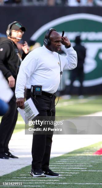 Assistant Head Coach and Inside Linebackers Coach Charlie Strong of the Jacksonville Jaguars follows the action against the New York Jets in the game...