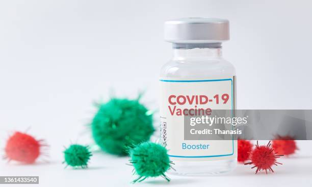 a covid-19 vaccine booster dose for new year's resolution. - booster dose stock-fotos und bilder