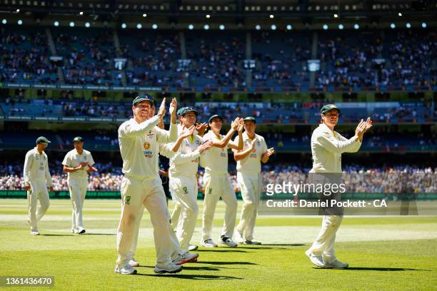 The Australian cricket team celebrate with fans after winning and retaining the Ashes on day three of the Third Test match in the Ashes series...