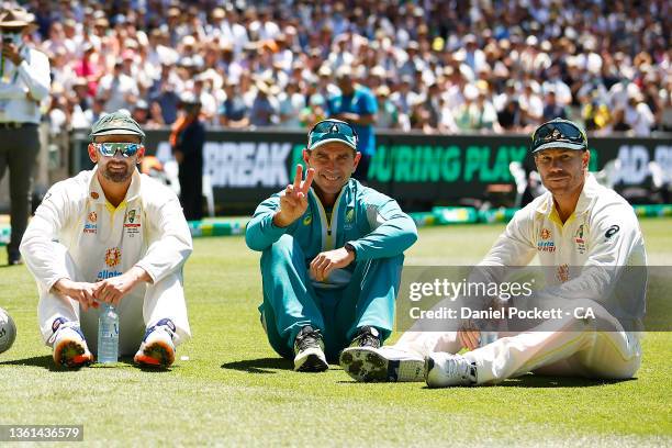 Nathan Lyon of Australia, Australia head coach Justin Langer and David Warner of Australia pose after winning and retaining the Ashes on day three of...