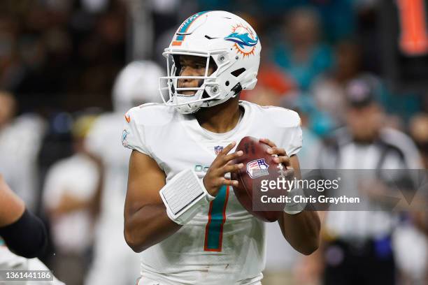 Tua Tagovailoa of the Miami Dolphins looks to pass during the first half against the New Orleans Saints at Caesars Superdome on December 27, 2021 in...