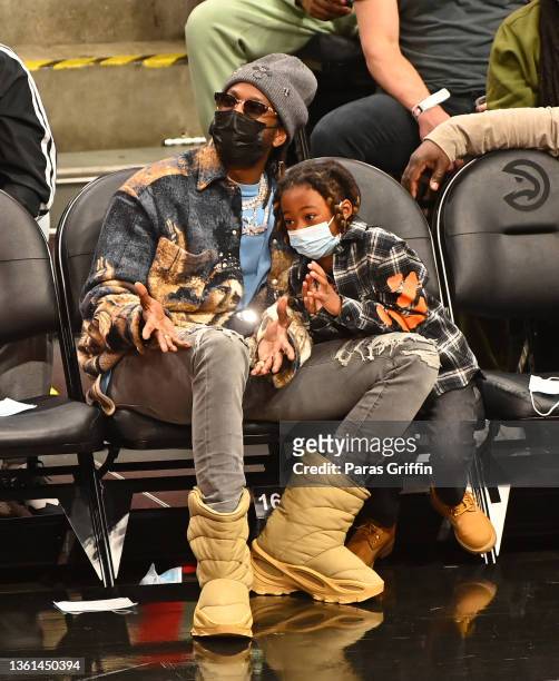 Rapper 2 Chainz and his son Halo Epps attend the game between the Chicago Bulls and the Atlanta Hawks at State Farm Arena on December 27, 2021 in...