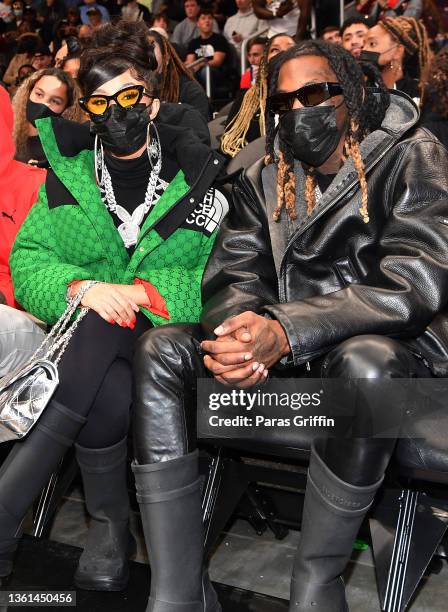 Cardi B and Offset attend the game between the Chicago Bulls and the Atlanta Hawks at State Farm Arena on December 27, 2021 in Atlanta, Georgia.