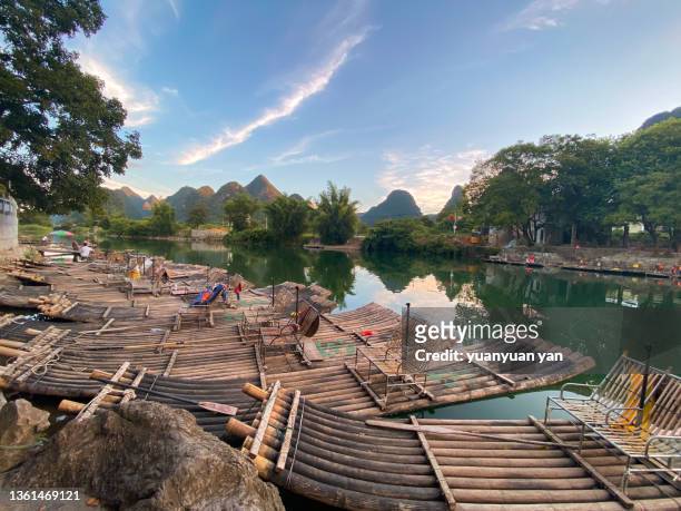 landscape of yangshuo guilin china - bamboo raft ストックフォトと画像