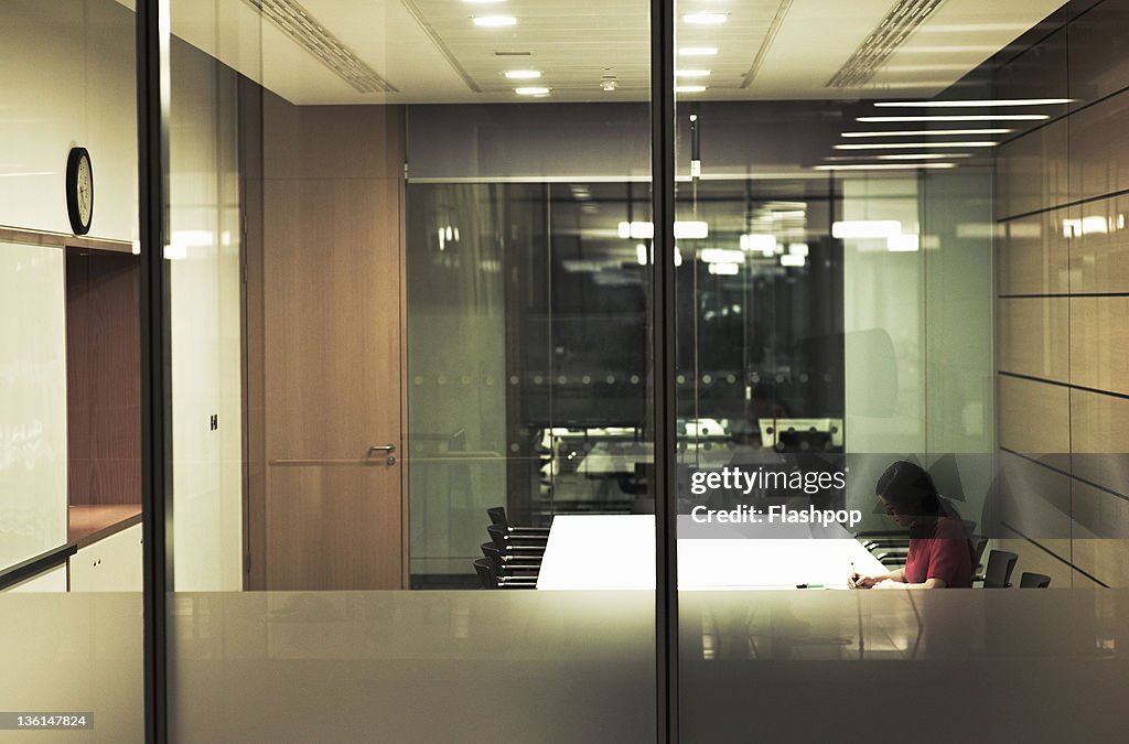 Business woman working in boardroom