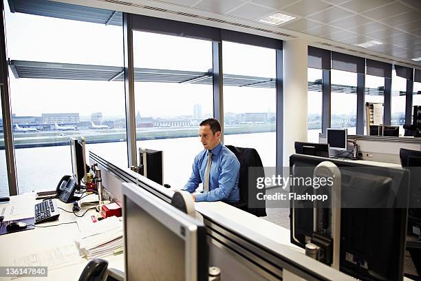 business man working at desk - microsoft stock pictures, royalty-free photos & images