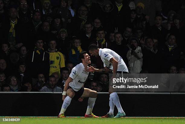 Gareth Bale of Spurs celebrates scoring the opening goal with team mate Kyle Walker of Spurs during the Barclays Premier Leauge match between Norwich...