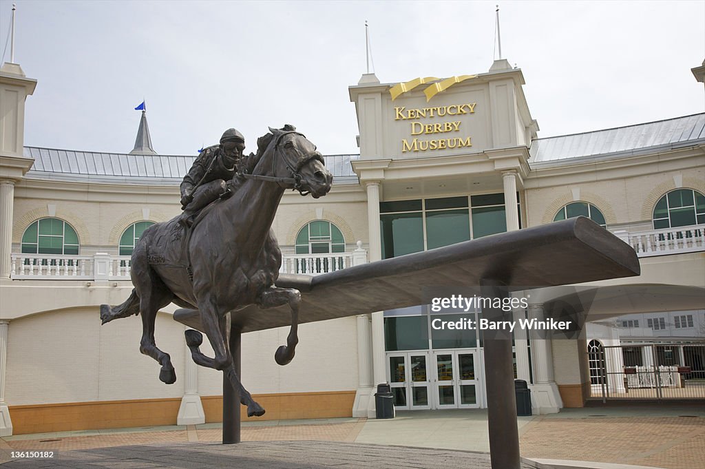 Sculpture of jockey and horse seen from below.