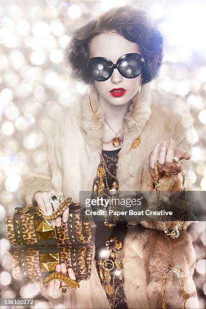 over-dressed glamorous lady with gold chains - gold purse chain stock pictures, royalty-free photos & images