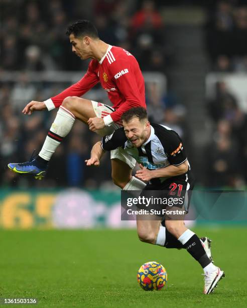 Cristiano Ronaldo of Manchester United fouls Ryan Fraser of Newcast during the Premier League match between Newcastle United and Manchester United at...