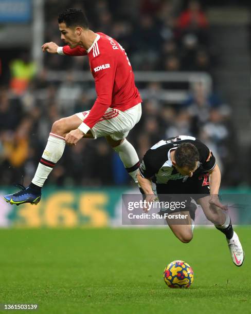 Cristiano Ronaldo of Manchester United fouls Ryan Fraser of Newcastle during the Premier League match between Newcastle United and Manchester United...