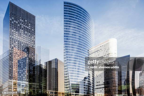 composite of high rise buildings in paris la defense - banker doppelbelichtung stock-fotos und bilder