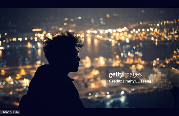 people silhouette and bokeh - young man asian silhouette stock pictures, royalty-free photos & images