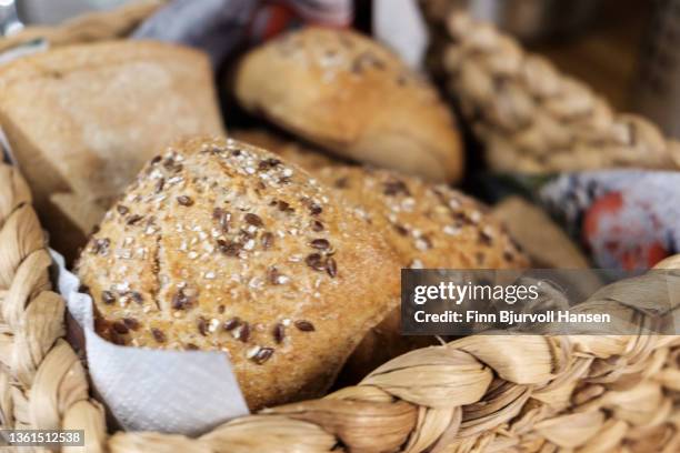 freshly baked rolls in a basket - finn bjurvoll stock pictures, royalty-free photos & images