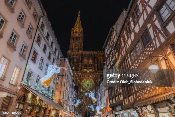 crowd on christmas market in strasbourg - strasbourg stock pictures, royalty-free photos & images