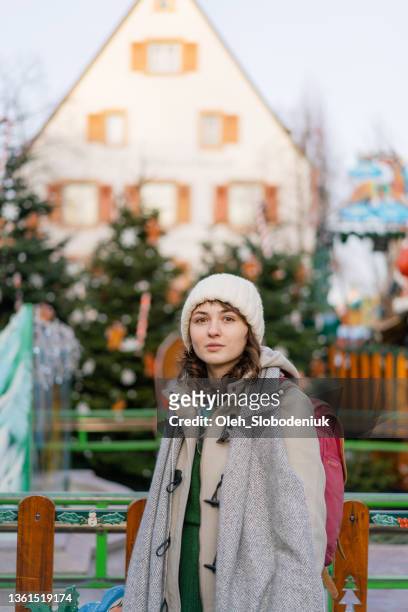 woman walking on  colmar christmas market - strasbourg winter stock pictures, royalty-free photos & images