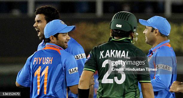 Zaheer Khanof India celebrates with teammates after taking the wicket of Pakistani batsman Kamran Akmal during the 2011 ICC World Cup semi-final...