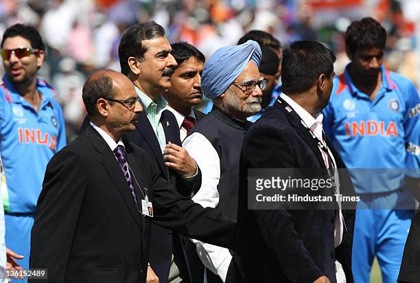 Indian Prime Minister Dr. Manmohan Singh along with Pakistan's Prime Minister Yousuf Raza Gilani during the 2011 ICC World Cup semi-final match...