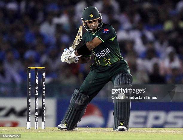 Asad Shafiq of Pakistan gets in position to play a shot during the 2011 ICC World Cup semi-final match between India and Pakistan at PCA Stadium in...