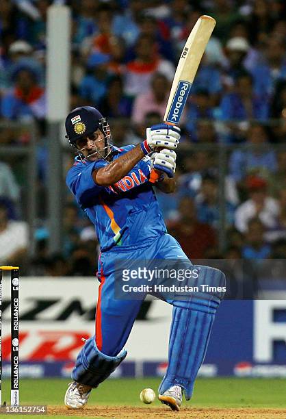 Mahendra Singh Dhoni of India playing a shot during the 2011 ICC World Cup final match between India and Sri Lanka at Wankhede stadium in Mumbai,...