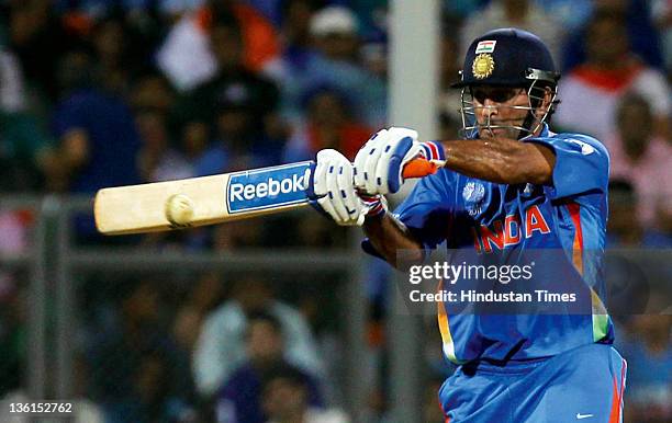 Mahendra Singh Dhoni of India plays a shot during the 2011 ICC World Cup final match between India and Sri Lanka at Wankhede stadium in Mumbai, India...