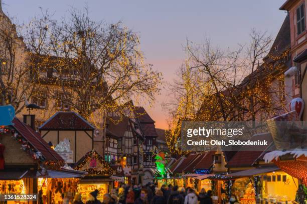christmas market at night in alsace region - strasbourg winter stock pictures, royalty-free photos & images