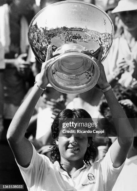 Argentine tennis player Gabriela Sabatini holds the trophy after winning the Argentine Open Tennis Tournament at Buenos Aires Lawn Tennis Club in...