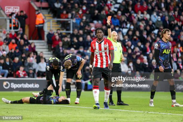 Mohammed Salisu of Southampton is adjudged to have fouled Heung-Min Son of Tottenham Hotspur in the box for a penalty and a scond yellow card for...