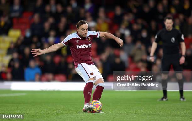 Mark Noble of West Ham United scores their sides third goal from the penalty spot during the Premier League match between Watford and West Ham United...