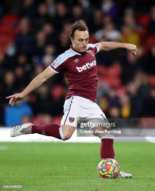 Mark Noble of West Ham United scores their sides third goal from the penalty spot during the Premier League match between Watford and West Ham United...