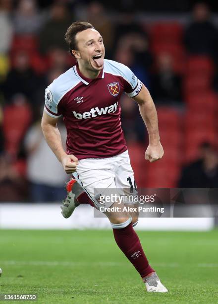 Mark Noble of West Ham United celebrates after scoring their sides third goal from the penalty spot during the Premier League match between Watford...